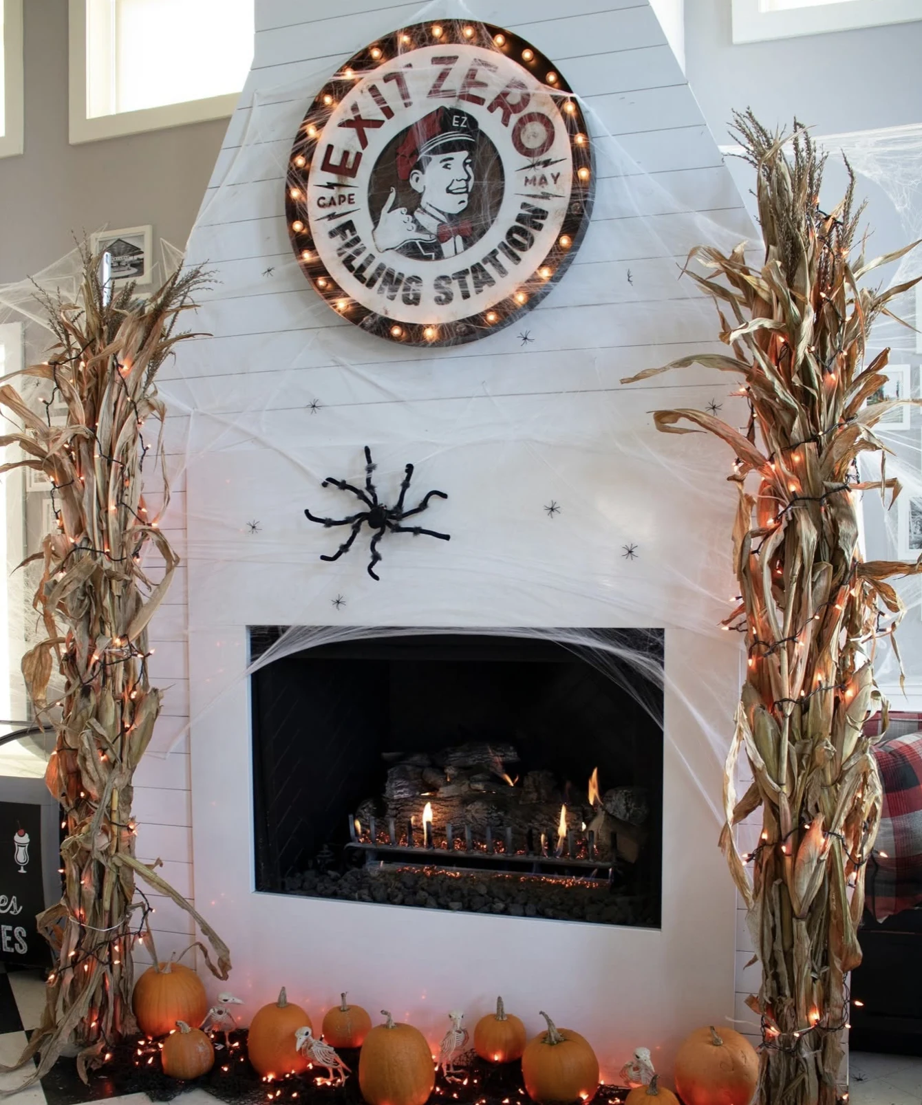 Exit Zero sign installed above the restaurant fireplace with seasonal decorations