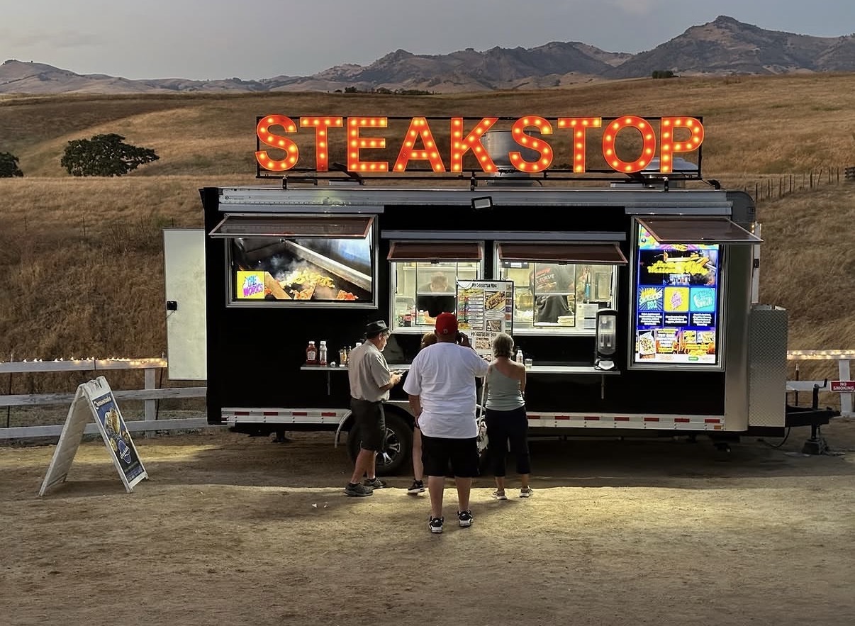 Steak Stop food truck with illuminated marquee sign