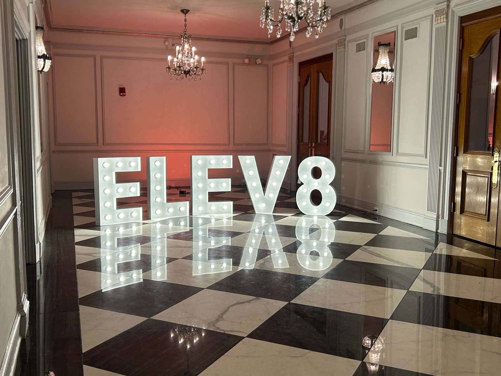 Stand-up marquee letters spelling ELEV8 at an event venue