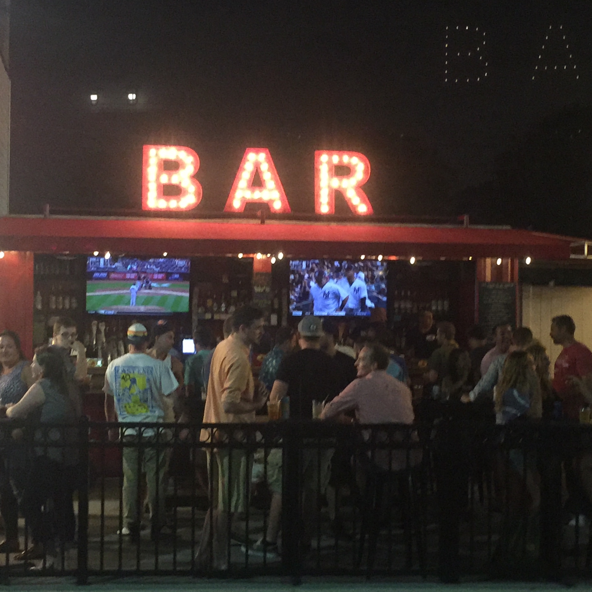 BAR illuminated marquee sign at food venue