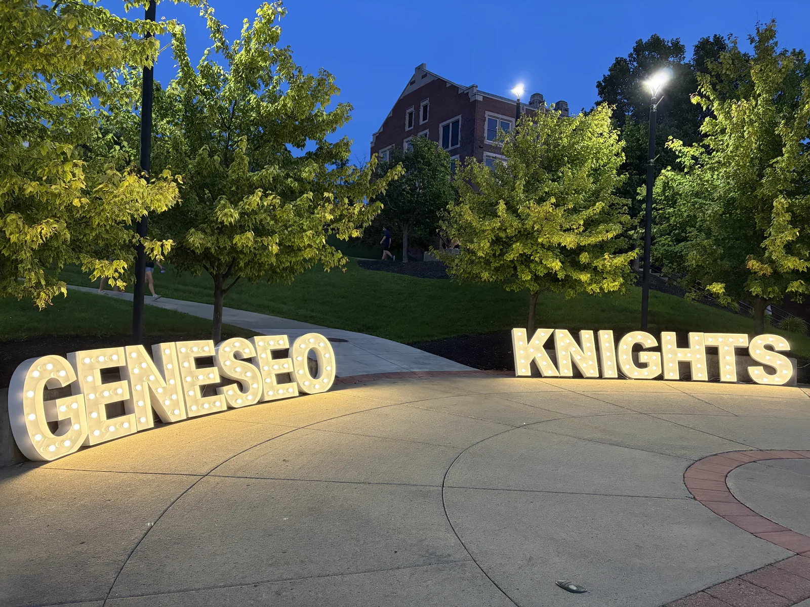 GENESEO KNIGHTS illuminated marquee letters outdoors at Geneseo, a university in New York.